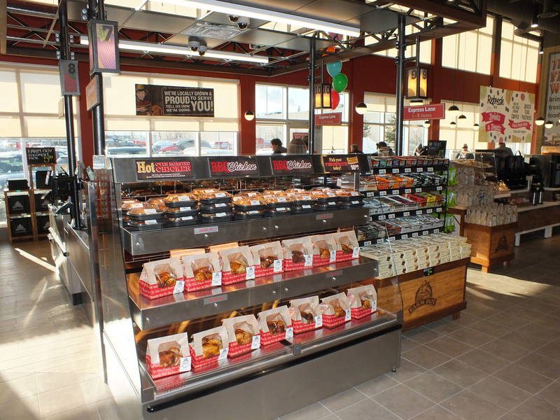 Roasted chicken pickup is positioned by the cashier area for yet another quick and convenient "grab and go" meal option for shoppers